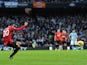 Robin Van Persie strikes the ball to score the winner against rivals Manchester City on December 9, 2012