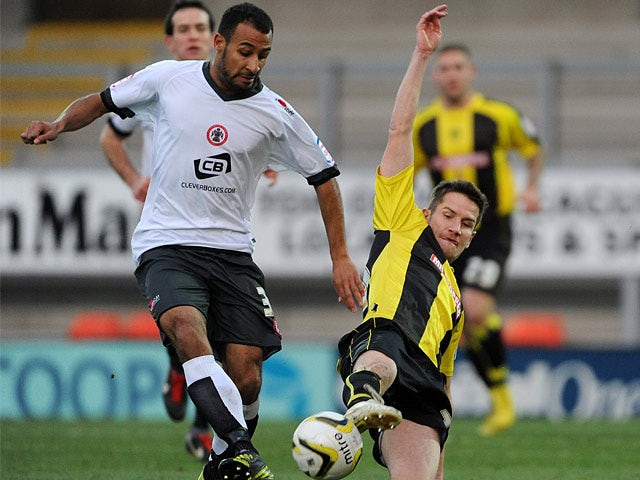 Accrington Stanley's Rommy Boco and Burton Albion's Lee Bell battle for the ball on December 9, 2012
