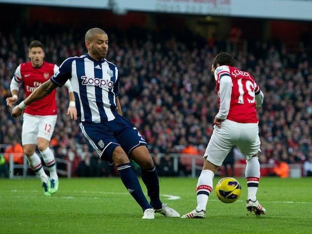 Arsenal midfielder Santi Cazorla wins a controversial penalty against West Brom on December 8, 2012