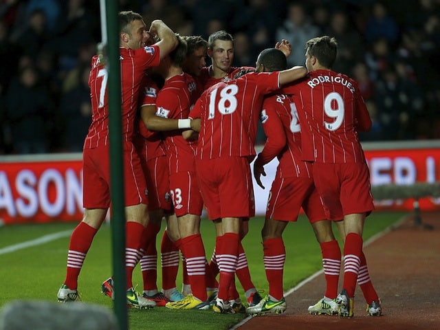 Southampton players mob Jason Puncheon after his strike against Reading on December 8, 2012