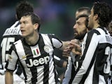 Juventus' Stephan Lichtsteiner is congratulated by team-mates after scoring the winning goal against Palermo on December 9, 2012