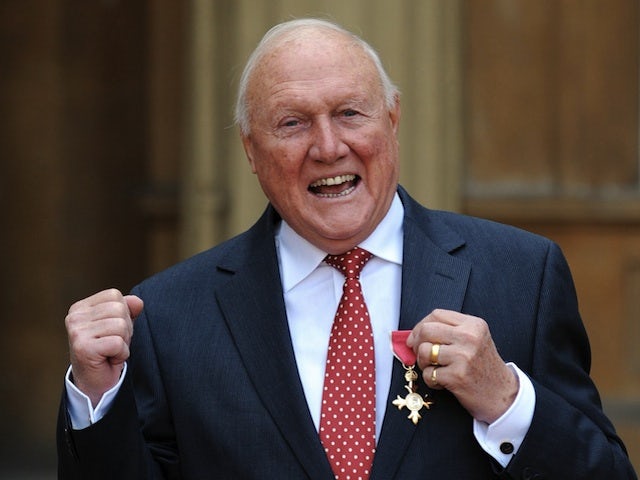 Broadcaster Stuart Hall receiving his OBE on March 22, 2012 