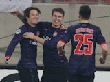 Arsenal's Tomas Rosicky is congratulated after scoring on December 4, 2012