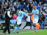 Vincent Kompany is substituted for Kolo Toure after picking up an injury on December 9, 2012