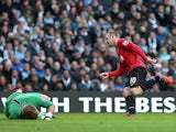 Wayne Rooney slots the ball past Joe Hart to score his second goal on December 9, 2012