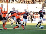 Dundee United's Willo Flood scores his team's third goal against rivals Dundee on December 9, 2012