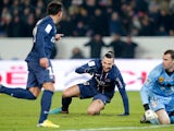 Paris Saint Germain's Ezequiel Lavezzi is congratulated by Zlatan Ibrahimovic after scoring his team's second goal on December 8, 2012