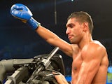 Amir Khan celebrates after stopping Carlos Molina in round 10 on December 15, 2012