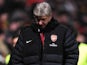 Arsenal boss Arsene Wenger looks dejected at half-time against Bradford on December 11, 2012