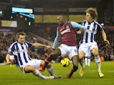 Hammers striker Carlton Cole battles West Brom defenders on December 16, 2012
