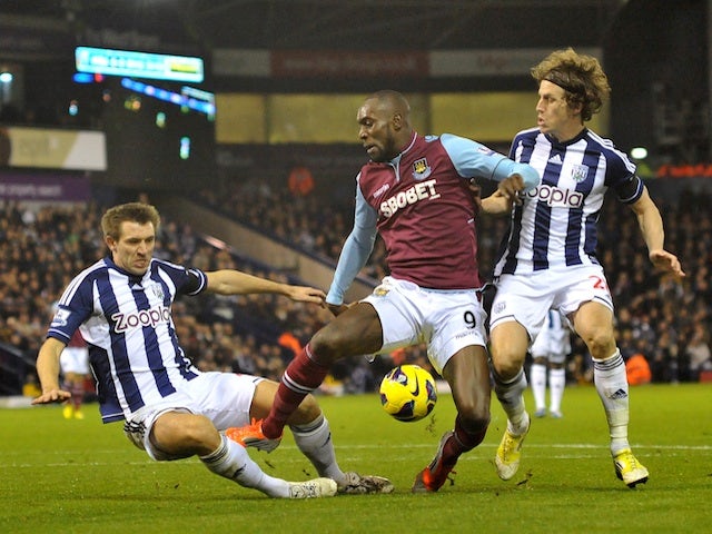 Hammers striker Carlton Cole battles West Brom defenders on December 16, 2012