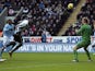 Newcastle striker Demba Ba heads the ball past Joe Hart on December 15, 2012