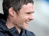 Fleetwood Town manager Graham Alexander smiles during the match against Gillingham on December 15, 2012