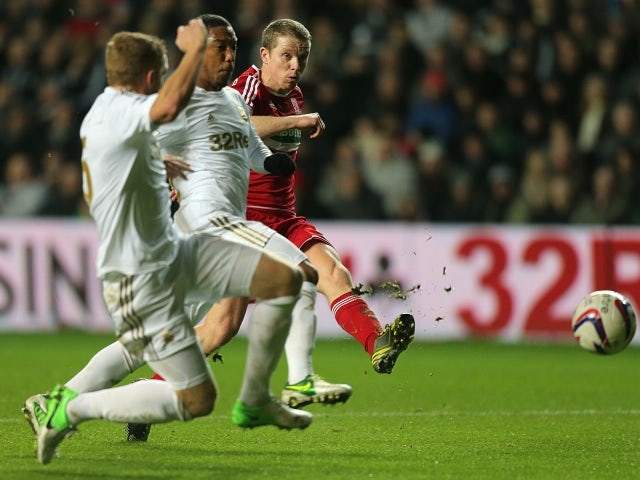 Middlesbrough's Grant Leadbitter has a shot on goal against Swansea City on December 12, 2012