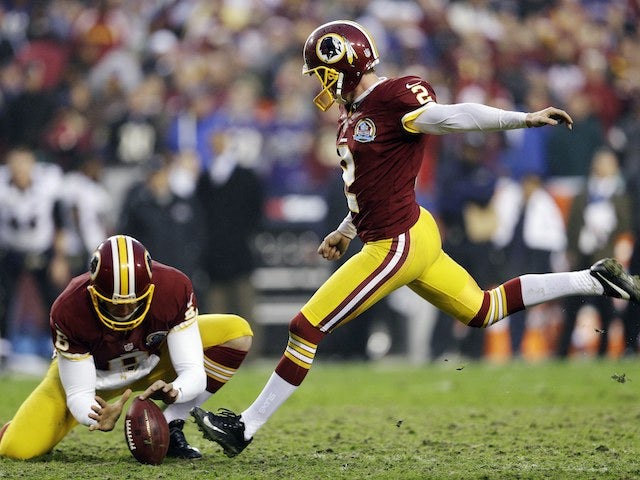 Kai Forbath kicks the winning goal for the Washington Redskins on December 9, 2012