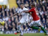 Kyle Walker and Wayne Routledge battle for the ball on December 16, 2012
