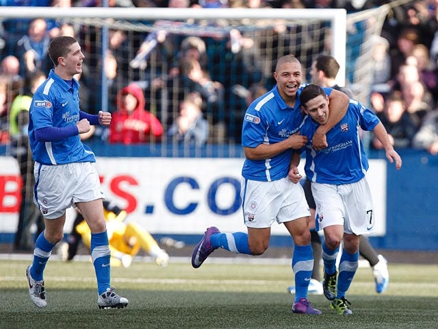 Montrose's Lloyd Young is congratulated by team mates after scoring the opener against Rangers on December 15, 2012