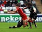 Toulouse's Luke Burgess is tackled by an Osprey player on December 15, 2012