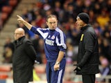 Martin O'Neill lectures the fourth official as Brian McDermott watches the action on December 11, 2012