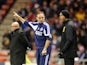 Martin O'Neill lectures the fourth official as Brian McDermott watches the action on December 11, 2012