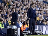 Swansea City manager Michael Laudrup and Tottenham Hotspur head coach Andre Villas-Boas watch their teams on December 16, 2012