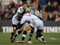 Harlequins' Mike Brown is tackled by Zebra's Samuele Pace and Giovanbattista Venditti on December 15, 2012