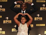 Mo Farah and his daughter do the 'Mobot' on the red carpet at Sports Personality of the Year on December 16, 2012