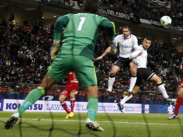 Corinthians' Paolo Guerrero scores against Al-Ahly SC in the Club World Cup on December 12, 2012