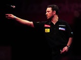 Australian Paul Nicholson throws during his match at Alexandra Palace on December 14, 2012