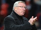 Man Utd boss Sir Alex Ferguson applauds his team after winning 3-1 against Sunderland on December 15, 2012