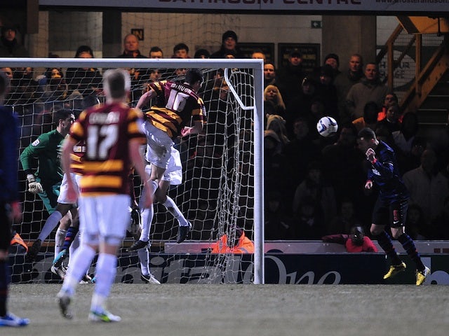 Arsenal captain Thomas Vermaelen scores a late equaliser against Bradford on December 11, 2012