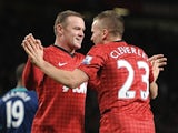Tom Cleverley congratulates Wayne Rooney after his goal on December 15, 2012