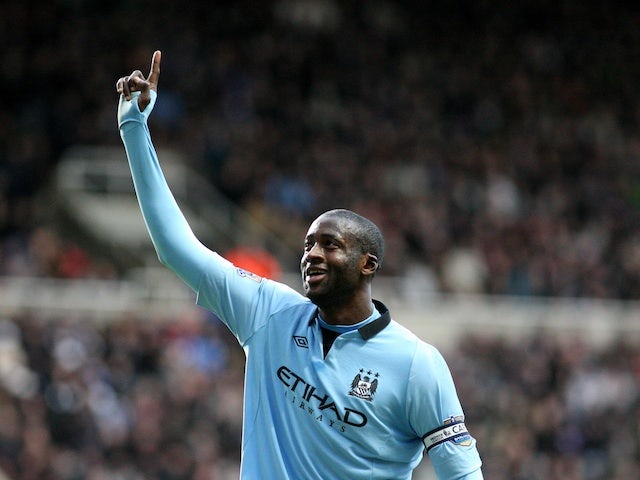 CIty midfielder Yaya Toure celebrates the third goal in the 3-1 win over Newcastle on December 15, 2012