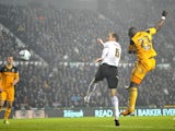 Hull's Abdoulaye Faye jumps to score their winning goal against Derby on December 21, 2012