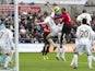 United's Patrice Evra jumps highest to open the scoring against Swansea on December 23, 2012