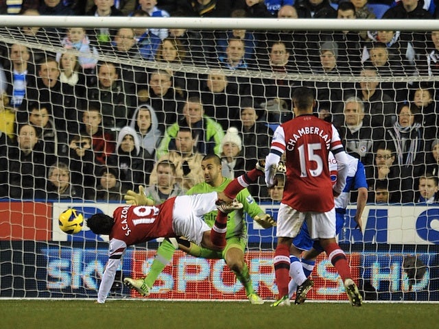 Santi Cazorla heads to put Arsenal 2-0 up at Reading on December 17, 2012