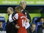 Gunners boss Arsene Wenger hugs goalscorer Theo Walcott as he comes off at Reading on December 17, 2012
