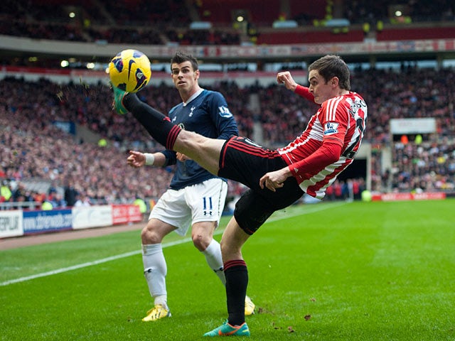 Adam Johnson beats Gareth Bale to the ball on December 29, 2012