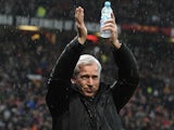 Newcastle boss Alan Pardew applauds the travelling Magpies fans at Old Trafford on December 26, 2012