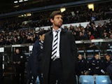Spurs boss AVB stands in the dugout before the game with Aston Villa on Boxing Day 2012