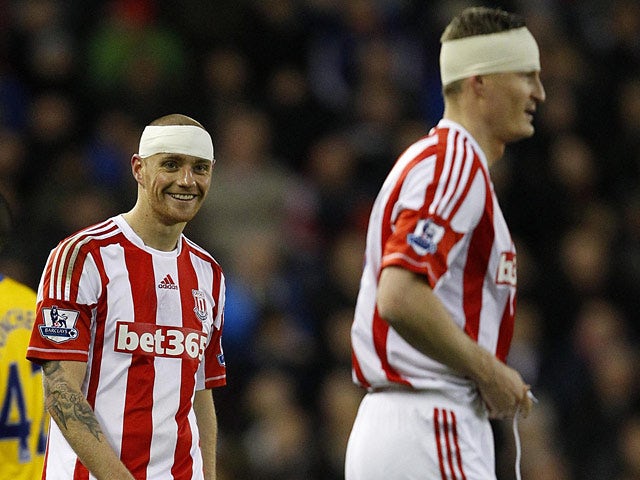 Stoke City defenders Andy Wilkinson and Robert Huth with bandaged heads after clashing heads during the match on December 29, 2012