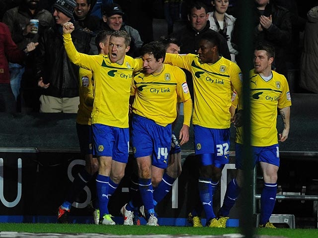 Stephen Elliott is congratulated by team mates after scoring his first goal on December 29, 2012
