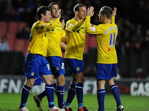 Stephen Elliott is congratulated by team mates after scoring his second goal on December 29, 2012