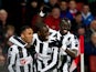 Demba Ba celebrates with team mates after scoring his first against Arsenal on December 29, 2012