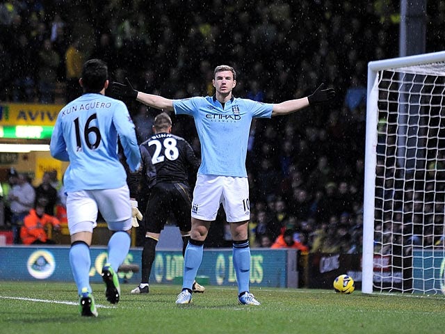 Half-Time Report: Early Dzeko double gives 10-man City lead