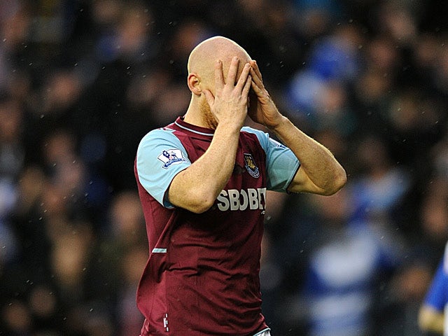 James Collins holds his head in his hands after gifting the ball to Pavel Pogrebnyak to score the opener on December 29, 2012
