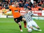 Dundee United's Johnny Russell and St Mirren's Paul Dummet battle for the ball on December 30, 2012