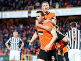 Dundee United's John Rankin congratulates Jon Daly after scoring a penalty against St Mirren on December 30, 2012