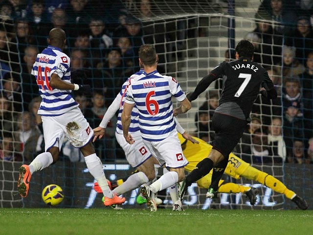 Luis Suarez scores the opener against QPR on December 30, 2012