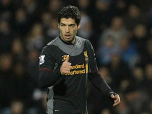 Luis Suarez gives the thumbs up after scoring his second goal against QPR on December 30, 2012
